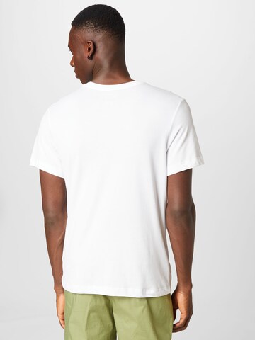 T-Shirt fonctionnel NIKE en blanc