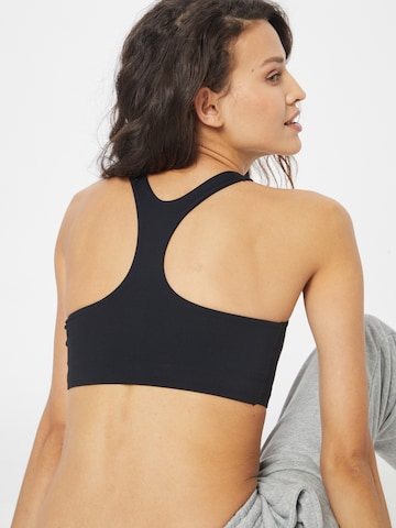 Bustino Reggiseno sportivo 'Alate' di NIKE in nero