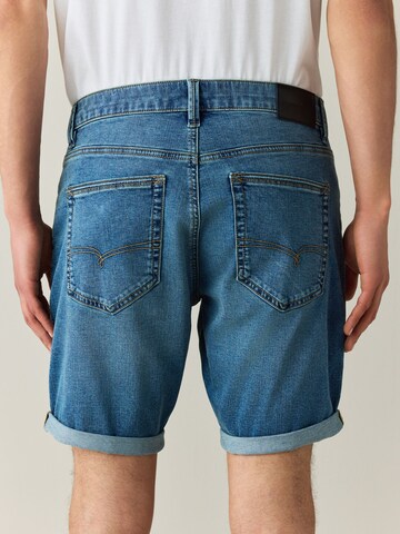 Coupe slim Jean 'Motion Flex' Next en bleu