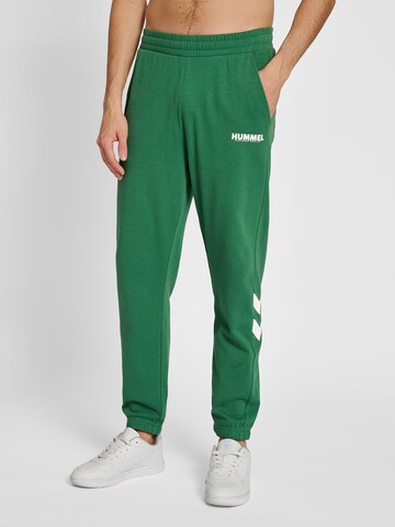 Tapered Pantaloni sportivi di Hummel in verde