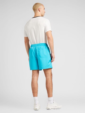 Nike Sportswear Voľný strih Nohavice 'Club' - Modrá