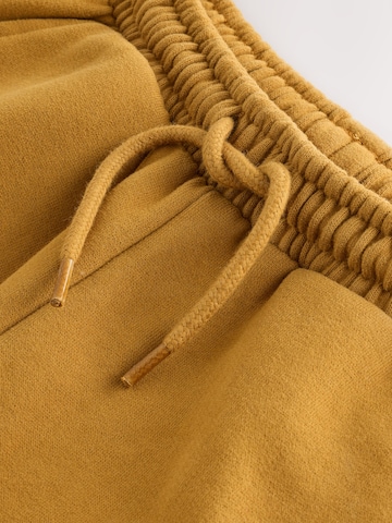 Next Tapered Housut värissä keltainen