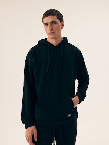 Felpa 'Kapuzensweatshirt Motion, French Terry, mit Rippbündchen' di Henderson in nero