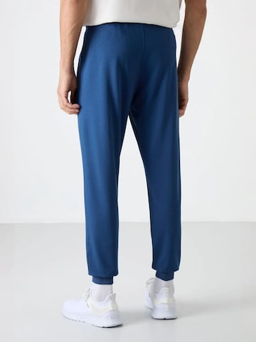 Tommy Life Tapered Workout Pants 'Jogginghose' in Blue