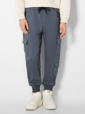 Bershka Tapered Chino Pants in Grey: front