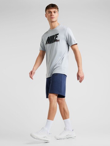 Nike Sportswear Ohlapna forma Hlače | modra barva