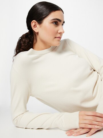 Pull-over Sisley en beige