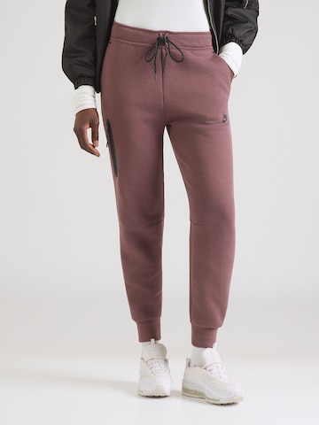 Nike Sportswear Конический (Tapered) Штаны 'TCH FLC' в Коричневый: спереди