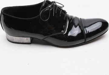 Louis Vuitton Flats & Loafers in 42,5 in Black: front