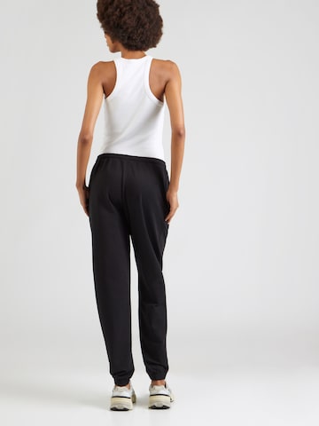 Effilé Pantalon Reebok en noir