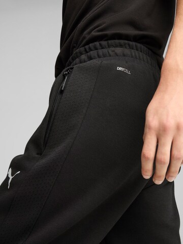 PUMA Slimfit Παντελόνι φόρμας 'Evostripe' σε μαύρο