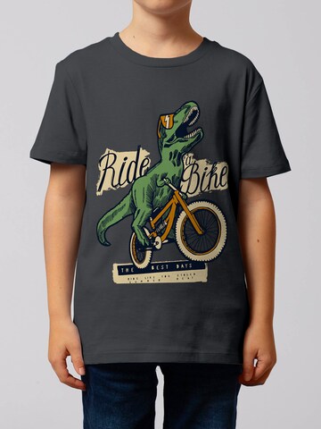 watabout.kids Shirt 'T-Rex Fahrrad' in Grijs: voorkant