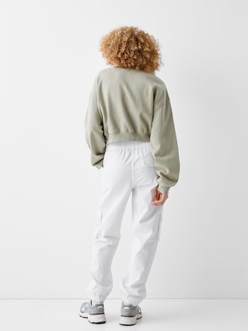 Bershka Loose fit Cargo trousers in White