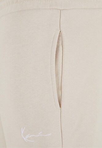 Karl Kani Loose fit Cargo Pants in Beige