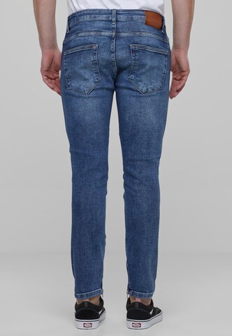 Skinny Jeans di Karl Kani in blu