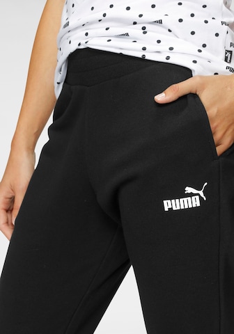 PUMA Tapered Sportbroek in Zwart