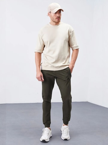 Tommy Life - Skinny Calças de desporto 'Jogginghose' em verde