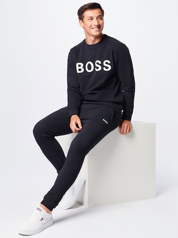 BOSS Orange Tapered Housut 'Skeefast' värissä musta