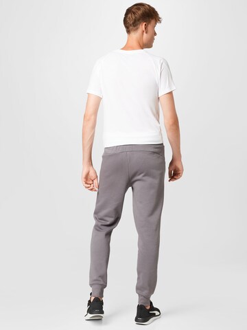 PUMA Tapered Sportbroek in Grijs