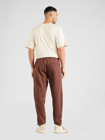 ELLESSE Tapered Pants 'Garsi' in Brown