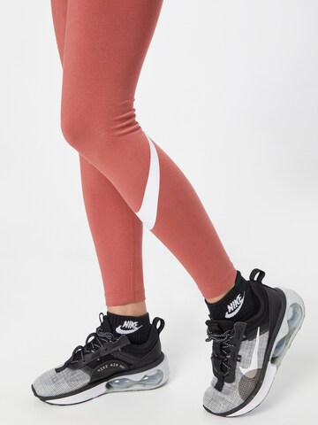 Skinny Leggings 'Essential' di NIKE in arancione