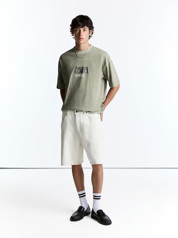 Pull&Bear Koszulka 'NIRVANA ONE DOLLAR' w kolorze zielony