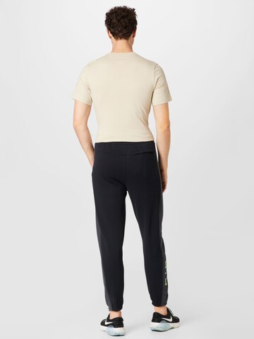 Nike Sportswear Tapered Trousers in Black