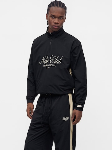 Nike Sportswear Wide leg Byxa 'Club' i svart