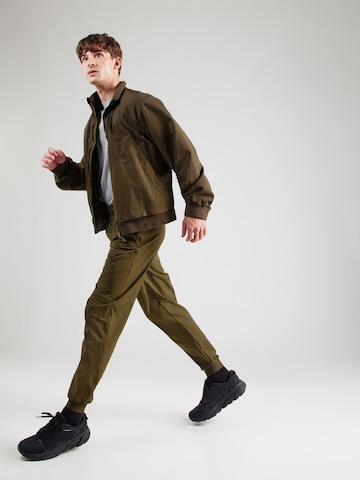 UNDER ARMOUR Конический (Tapered) Спортивные штаны 'Unstoppable' в Зеленый