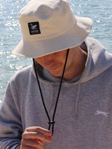 Chapeaux de sports Surf Monkey en blanc