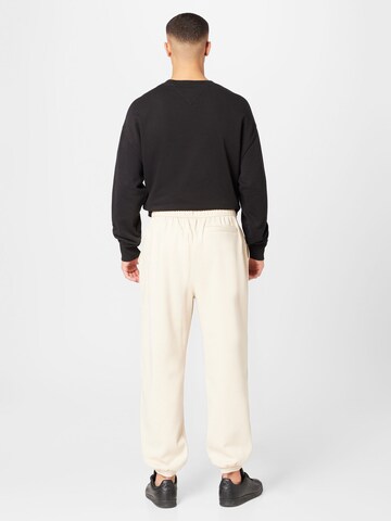 Calvin Klein Jeans Tapered Trousers 'INSTITUTIONAL' in Beige