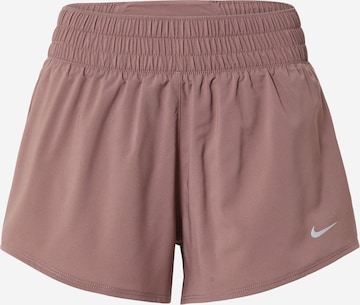 NIKE Workout Pants in Purple: front