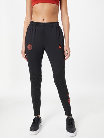 NIKE Skinny Workout Pants in Black: front