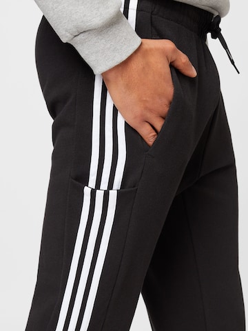 ADIDAS SPORTSWEAR Tapered Sports trousers 'Essentials' in Black