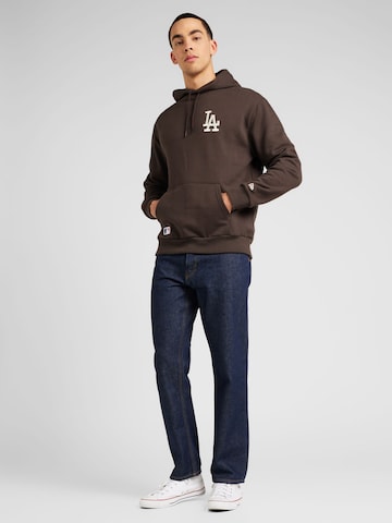 NEW ERA Sweatshirt 'League Essentials' in Braun