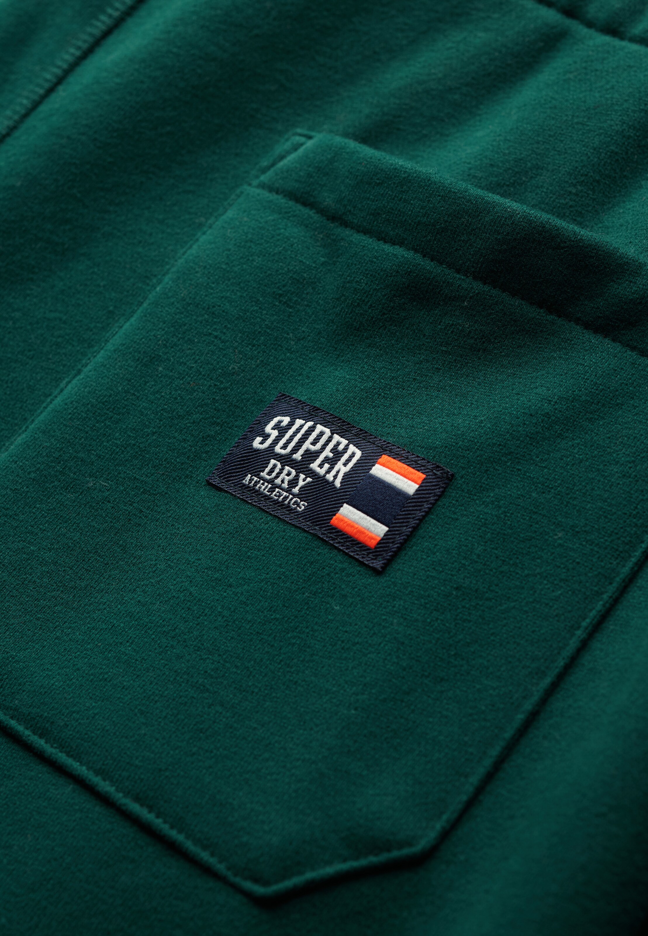 Superdry Tapered Broek 'Essential' in Groen