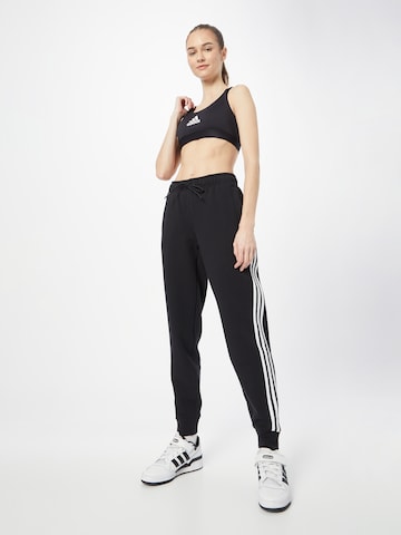 ADIDAS SPORTSWEAR Tapered Παντελόνι φόρμας 'Future Icons 3-Stripes ' σε μαύρο