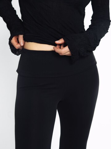 ABOUT YOU x Toni Garrn Flared Pants in Black