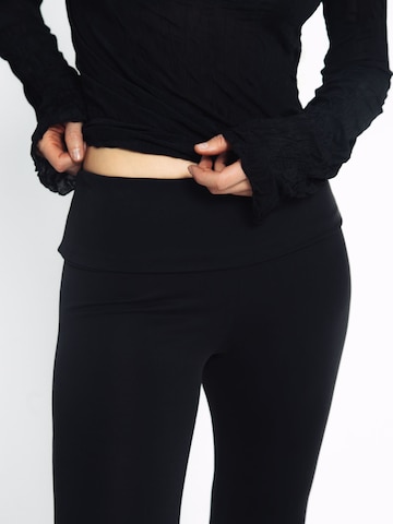 ABOUT YOU x Toni Garrn Flared Trousers in Black