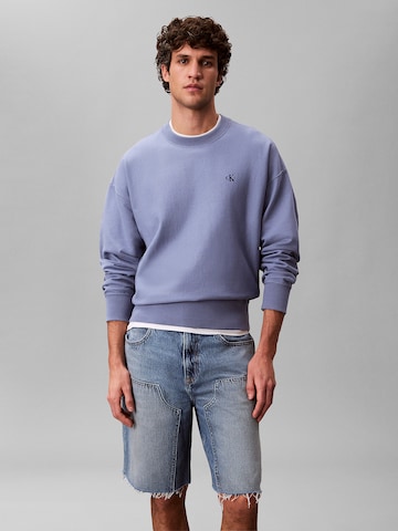 Sweat-shirt Calvin Klein Jeans en bleu : devant