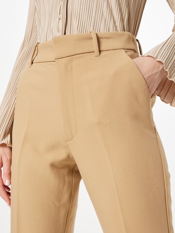 Flared Pantaloni con piega frontale di Abercrombie & Fitch in marrone