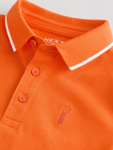 T-Shirt Next en orange