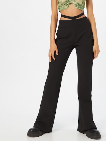 Trendyol Flared Trousers in Black: front