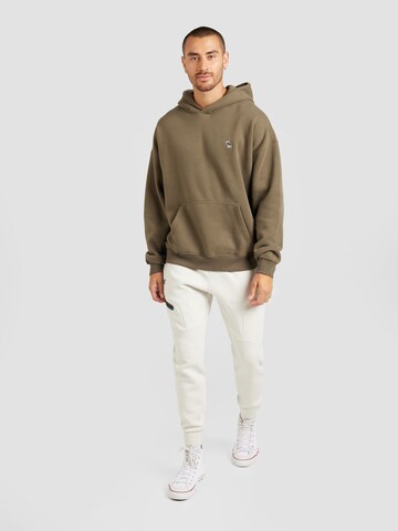 Effilé Pantalon de sport 'Unstoppable' UNDER ARMOUR en blanc