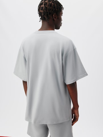 ABOUT YOU x Kingsley Coman T-Shirt 'Elia' in Grau