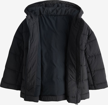 Next Välikausitakki värissä musta: etupuoli