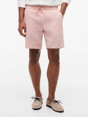 Pantalon chino TOMMY HILFIGER en rose : devant
