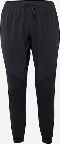 NIKE Regular Workout Pants in Black: front