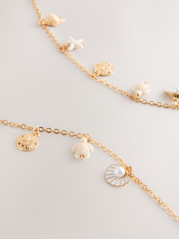 Next Brillenkette in Gold