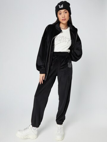 Tapered Pantaloni 'Dominic' di ABOUT YOU x Dardan in nero